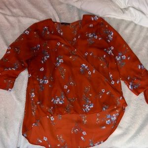 Red floral blouse
